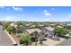 Desert community featuring single-Gathering homes with tiled roofs and mature landscaping on spacious lots and a blue sky at 3786 S Chaparral Rd, Apache Junction, AZ 85119