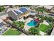 Aerial view showcasing the home, solar panels, pool, outdoor kitchen, and landscaped yard, offering a luxurious outdoor experience at 3786 S Chaparral Rd, Apache Junction, AZ 85119
