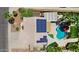 Aerial view of property highlighting solar panels, pool, outdoor entertainment area, and landscaping at 3786 S Chaparral Rd, Apache Junction, AZ 85119