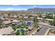 Panoramic aerial view of residential neighborhood with mountain views and solar panels on roofs at 3786 S Chaparral Rd, Apache Junction, AZ 85119
