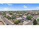 Aerial view showcasing a well-maintained residential neighborhood with tile roofs, lush greenery, and neat landscaping at 3786 S Chaparral Rd, Apache Junction, AZ 85119
