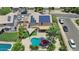 Aerial view of a house with a backyard pool, patio, and solar panels on the roof at 3786 S Chaparral Rd, Apache Junction, AZ 85119