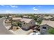 A neighborhood aerial shot with desert landscaping, tile roofs, and community amenities at 3786 S Chaparral Rd, Apache Junction, AZ 85119