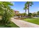 Inviting backyard oasis with a sparkling pool, lush landscaping, and stone accents, perfect for outdoor living and relaxation at 3786 S Chaparral Rd, Apache Junction, AZ 85119