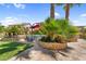 Lush backyard with sparkling pool, tropical landscaping, and cozy seating areas, creating a serene and inviting outdoor space at 3786 S Chaparral Rd, Apache Junction, AZ 85119