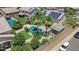 Aerial view of a private backyard featuring a pool, covered patio, and lush landscaping at 3786 S Chaparral Rd, Apache Junction, AZ 85119