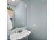 Small bathroom with blue walls, mirror, pedestal sink and granite counters at 3786 S Chaparral Rd, Apache Junction, AZ 85119