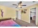 Bedroom with yellow walls, walk in closet, and a unique bedframe at 3786 S Chaparral Rd, Apache Junction, AZ 85119