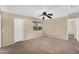 Bright bedroom offers a ceiling fan and a large window with natural light at 3786 S Chaparral Rd, Apache Junction, AZ 85119