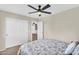 Bedroom with ceiling fan, closet, and an open door to another room at 3786 S Chaparral Rd, Apache Junction, AZ 85119