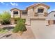 Inviting two-story home featuring a neutral color palette, well-kept landscaping, and attached two-car garage at 3786 S Chaparral Rd, Apache Junction, AZ 85119