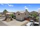 Charming two-story home with a two-car garage and neutral color scheme, complemented by desert landscaping at 3786 S Chaparral Rd, Apache Junction, AZ 85119