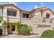 Inviting two-story home with desert landscaping, lush green trees, and an attached two-car garage at 3786 S Chaparral Rd, Apache Junction, AZ 85119