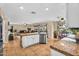 Open kitchen with granite countertops and stainless steel appliances overlooks the living area and backyard pool at 3786 S Chaparral Rd, Apache Junction, AZ 85119