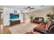 Spacious living room with tile flooring, ceiling fan, and comfortable leather seating at 3786 S Chaparral Rd, Apache Junction, AZ 85119