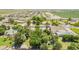 Aerial view showcasing the property and neighborhood, surrounded by mature trees and lush greenery, giving it a private feel at 3964 S Turquoise Dr, Buckeye, AZ 85326