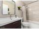 Bathroom featuring vanity, tile flooring, and tiled shower-bathtub combo with updated shower head and hardware at 3964 S Turquoise Dr, Buckeye, AZ 85326