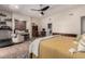 Comfortable bedroom showcasing a cozy sitting area with a window seat and wood-look floors at 3964 S Turquoise Dr, Buckeye, AZ 85326
