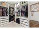 Walk-in closet provides ample storage with custom shelving, drawers, and hanging space at 3964 S Turquoise Dr, Buckeye, AZ 85326