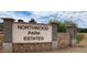 Welcome to Northwood Park Estates; sign featuring stone accents under a blue sky at 3964 S Turquoise Dr, Buckeye, AZ 85326