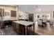 Open concept kitchen flowing into the living room featuring a large center island at 3964 S Turquoise Dr, Buckeye, AZ 85326