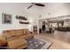 Spacious living room with hardwood floors, a leather sofa, and open floor plan at 3964 S Turquoise Dr, Buckeye, AZ 85326