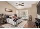 Comfortable main bedroom with neutral tones, french doors, and hardwood flooring and decor at 3964 S Turquoise Dr, Buckeye, AZ 85326