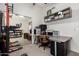 Bright office space with mirrored closet doors, neutral carpet, grey desk, and shelving for optimal home office usage at 3964 S Turquoise Dr, Buckeye, AZ 85326