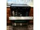 Close-up of a modern oven with a sleek design and open door showing the interior racks at 3964 S Turquoise Dr, Buckeye, AZ 85326