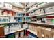 Walk-in pantry with ample shelving filled with a variety of groceries and household supplies at 3964 S Turquoise Dr, Buckeye, AZ 85326
