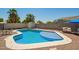 Sparkling pool with seating and desert landscaping, perfect for outdoor enjoyment at 3964 S Turquoise Dr, Buckeye, AZ 85326