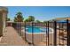 Backyard featuring a fenced pool and landscaping, perfect for relaxation and entertainment in this outdoor oasis at 3964 S Turquoise Dr, Buckeye, AZ 85326