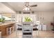 Eat-in kitchen with white dining set and access to the backyard through French doors at 4145 W Hayward Ave, Phoenix, AZ 85051