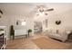 Open-concept living room with tile flooring, a stylish sofa, and views into the dining area at 4145 W Hayward Ave, Phoenix, AZ 85051