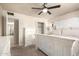 Spacious main bedroom with a ceiling fan and an en-suite bathroom at 4145 W Hayward Ave, Phoenix, AZ 85051