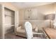 Office space with a comfortable couch, desk, chair, and closet storage at 4145 W Hayward Ave, Phoenix, AZ 85051