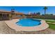 Inviting backyard pool with a desert landscape and pristine blue water at 4145 W Hayward Ave, Phoenix, AZ 85051