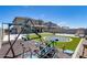 Spacious backyard with playground, trampoline, slide, and outdoor fireplace and plenty of room for activities at 41650 W Barcelona Dr, Maricopa, AZ 85138