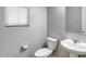 Powder room with toilet and pedestal sink at 41650 W Barcelona Dr, Maricopa, AZ 85138