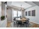 Elegant dining room with modern lighting and stylish decor at 41650 W Barcelona Dr, Maricopa, AZ 85138