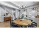 Open dining room with wood floors and a modern chandelier at 41650 W Barcelona Dr, Maricopa, AZ 85138