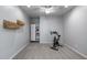 Minimalist room with carpet and a exercise machine and storage at 41650 W Barcelona Dr, Maricopa, AZ 85138