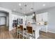 Beautiful kitchen with white cabinetry, stainless steel appliances, and a large center island at 41650 W Barcelona Dr, Maricopa, AZ 85138