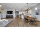Spacious living area with dining area, kitchen, and modern decor at 41650 W Barcelona Dr, Maricopa, AZ 85138