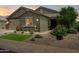 Charming single-Gathering home featuring desert landscaping and a well-maintained lawn at 41926 W Sussex Dr, Maricopa, AZ 85138