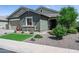 Charming single-Gathering home featuring desert landscaping and a well-maintained lawn at 41926 W Sussex Dr, Maricopa, AZ 85138