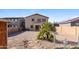 Large backyard with desert landscaping, privacy fence, and potential for outdoor living space at 42564 W Palmyra Ln, Maricopa, AZ 85138