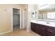 Bathroom with a double sink vanity, a full shower and tile flooring at 42564 W Palmyra Ln, Maricopa, AZ 85138