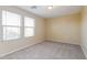 Bright bedroom featuring natural light and neutral decor at 42564 W Palmyra Ln, Maricopa, AZ 85138