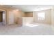 The loft area is well lit from the natural light and has carpeted floors at 42564 W Palmyra Ln, Maricopa, AZ 85138